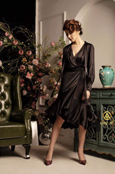 Silk wrap dress with flared hem and long sleeves in soft satin finish for elegant occasions